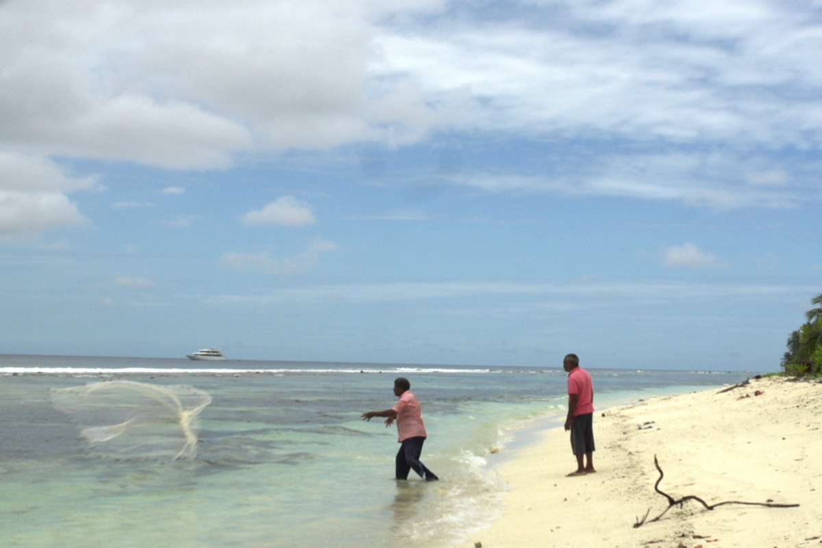 Boutique Beach Maldives Local Fishermen Casting Out Nets from The Beach