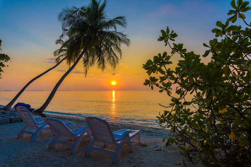 Boutique Beach Maldives Sunset with Deckchairs on the beach