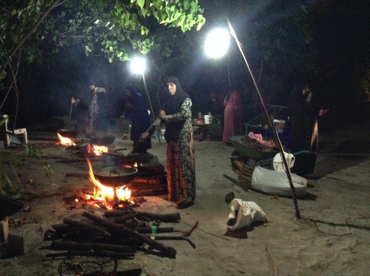 Boutique Beach Maldives Local Women Cooking Traditional Food on Open Fires Outdoors