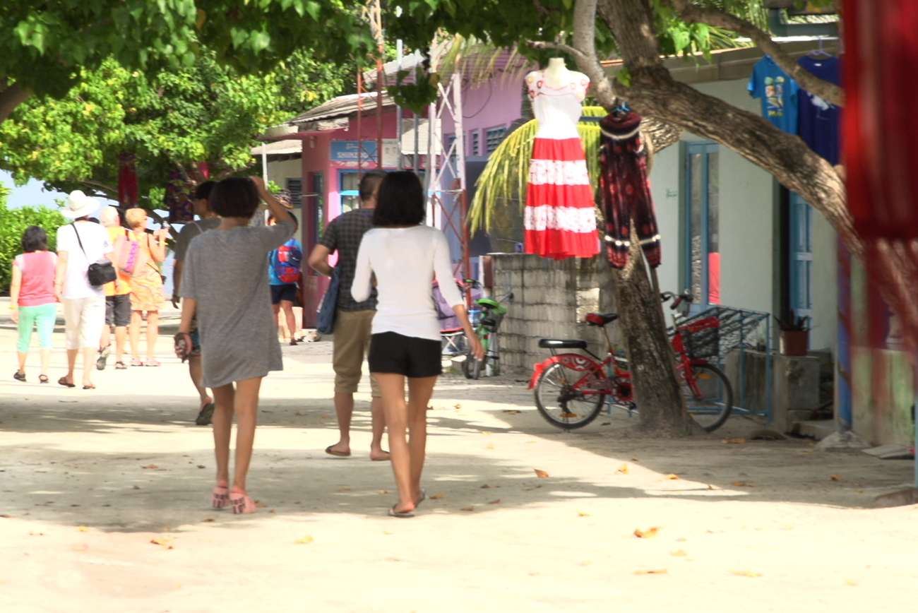 Boutique Beach Maldives Dhigurah Island Typical Street Scene with Tourists Strolling and Shopping