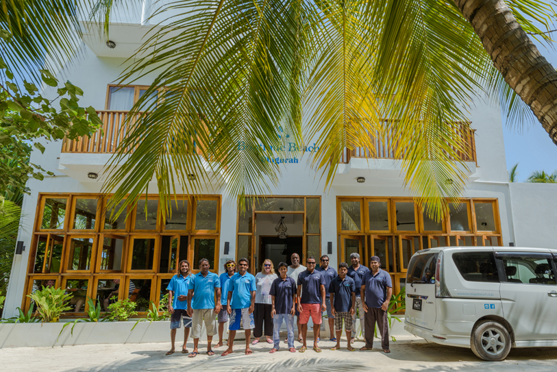 Boutique Beach Hotel Staff Group Photo outside the Hotel
